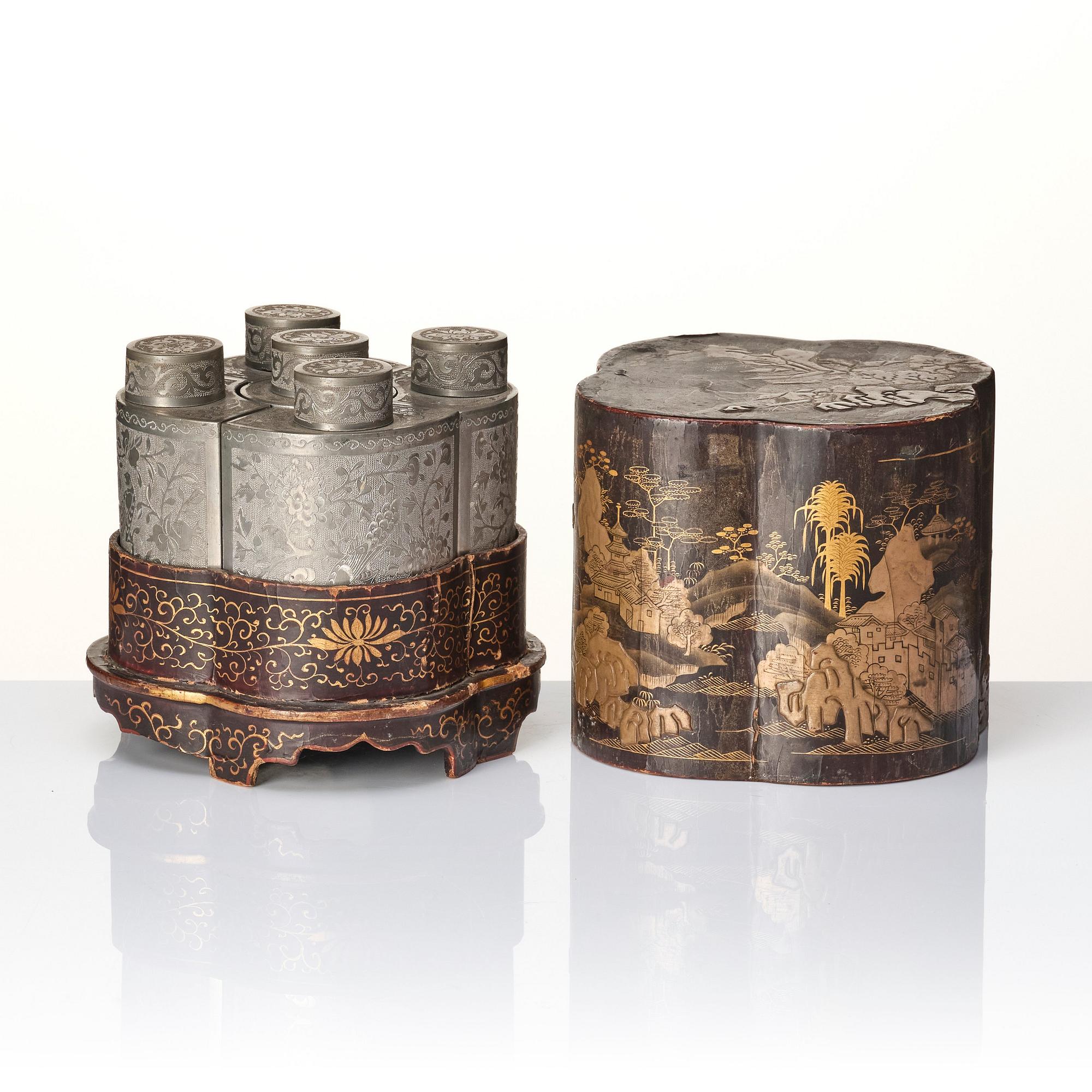 A Chinese lacquer box with a set of five pewter tea caddies, Qing dynasty, 18/19th Century.