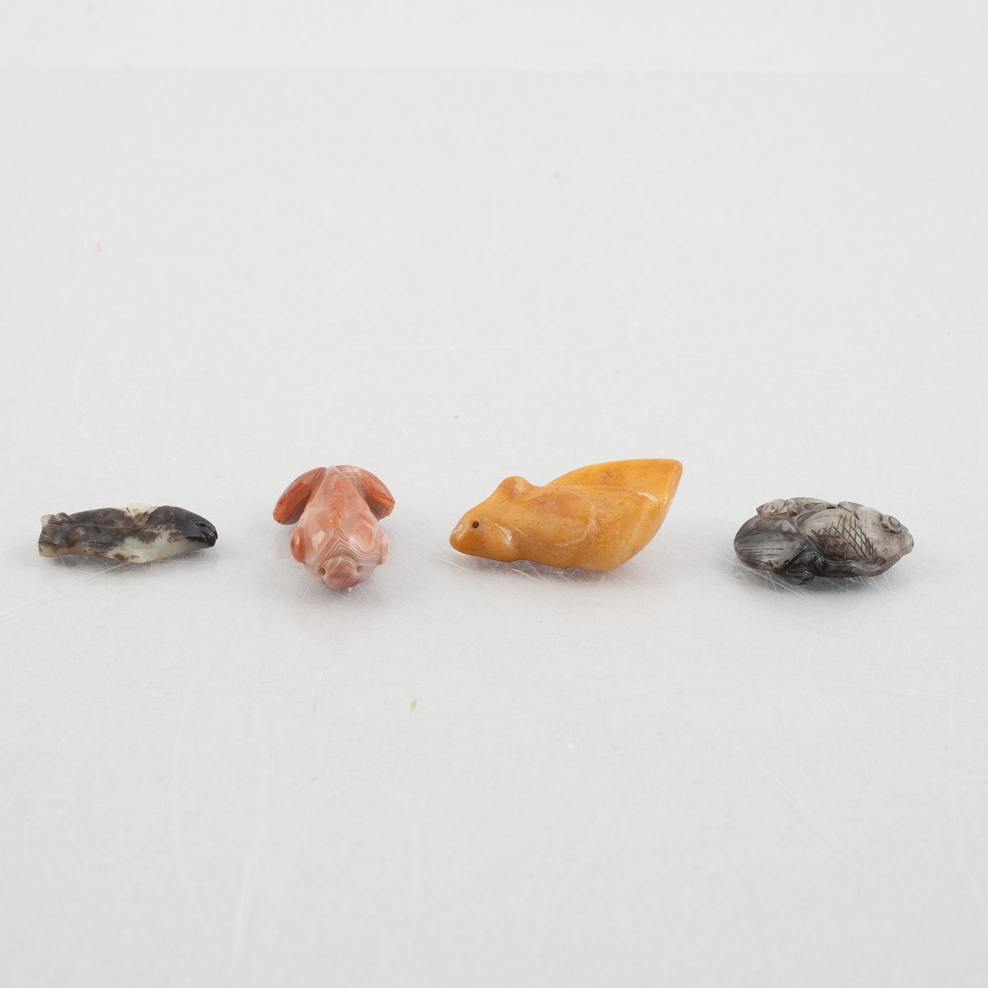 A group of eight Chinese stone charms / pendants, 20th century.