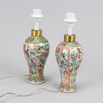 A pair of famille rose Canton table lamps and a pair of vases, late Qing dynasty, 19th Century.