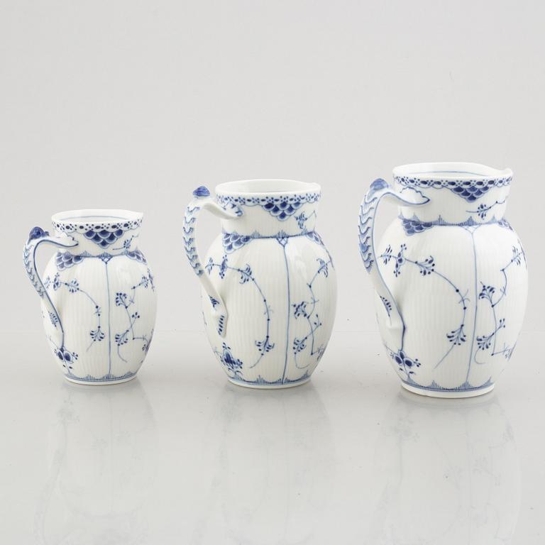 Three 'Blue Fluted Half Lace' / 'Musselmalet' porcelain jugs, Royal Copenhagen, model 562, 561, 763, 1898-1923 and 1962.