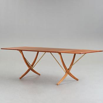 Hans J. Wegner, a teak, beech and brass dining table, model "AT-314", for Andreas Tuck, Denmark 1950-60's.