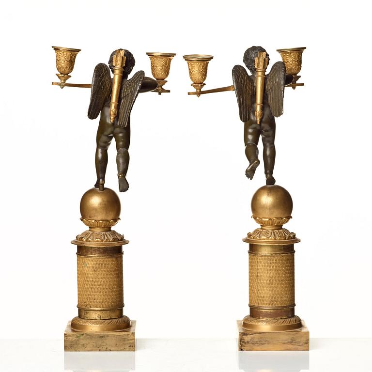 A pair of French Empire two-light candelabra.