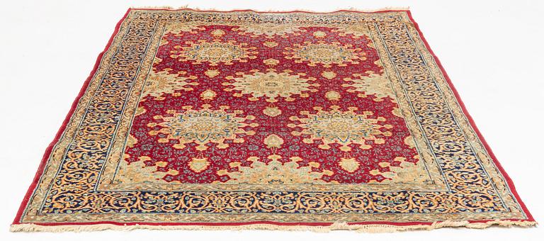 An oriental carpet, c. 290 x 198 cm.