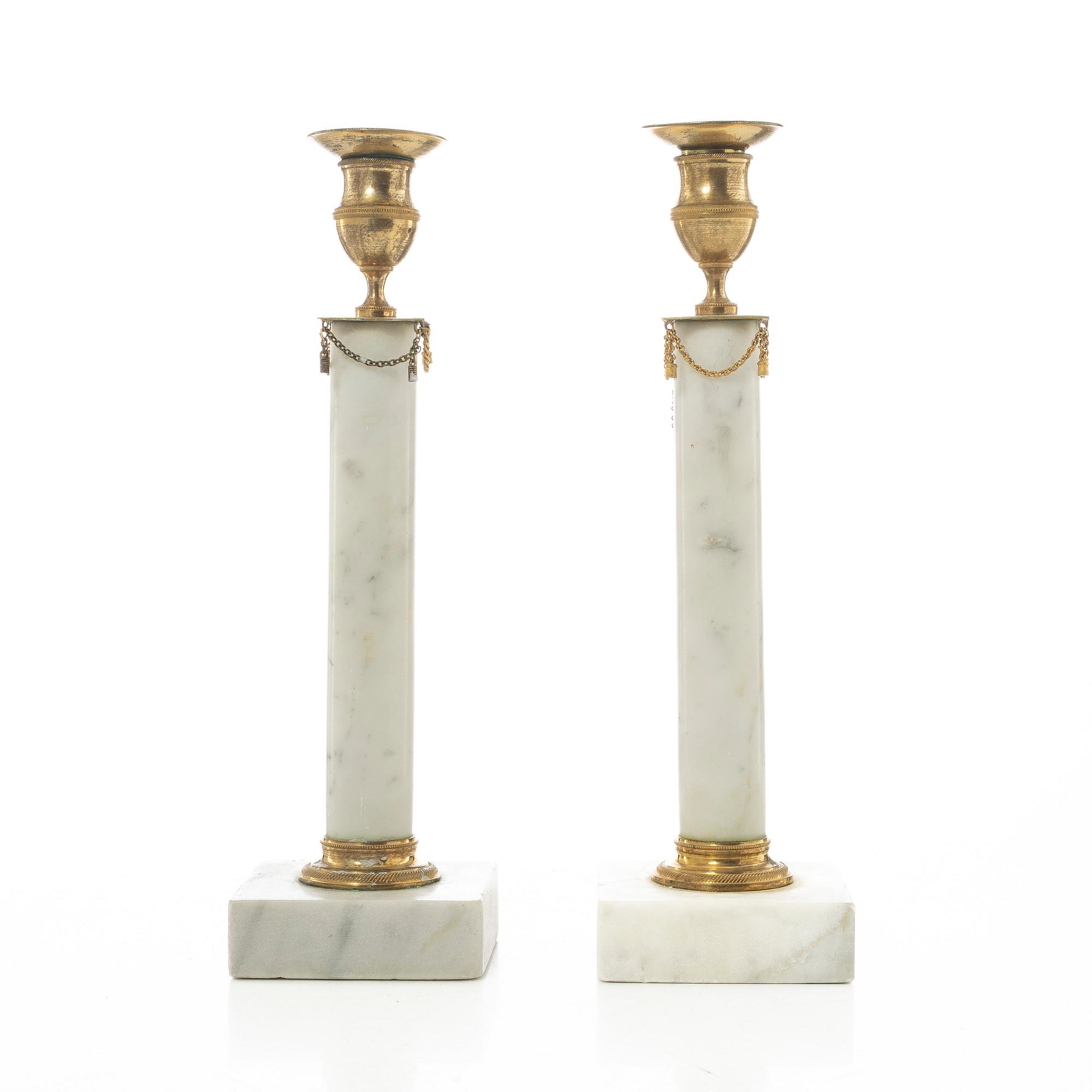 A pair of late Gustavian gilt brass and marble candlesticks, circa 1800.