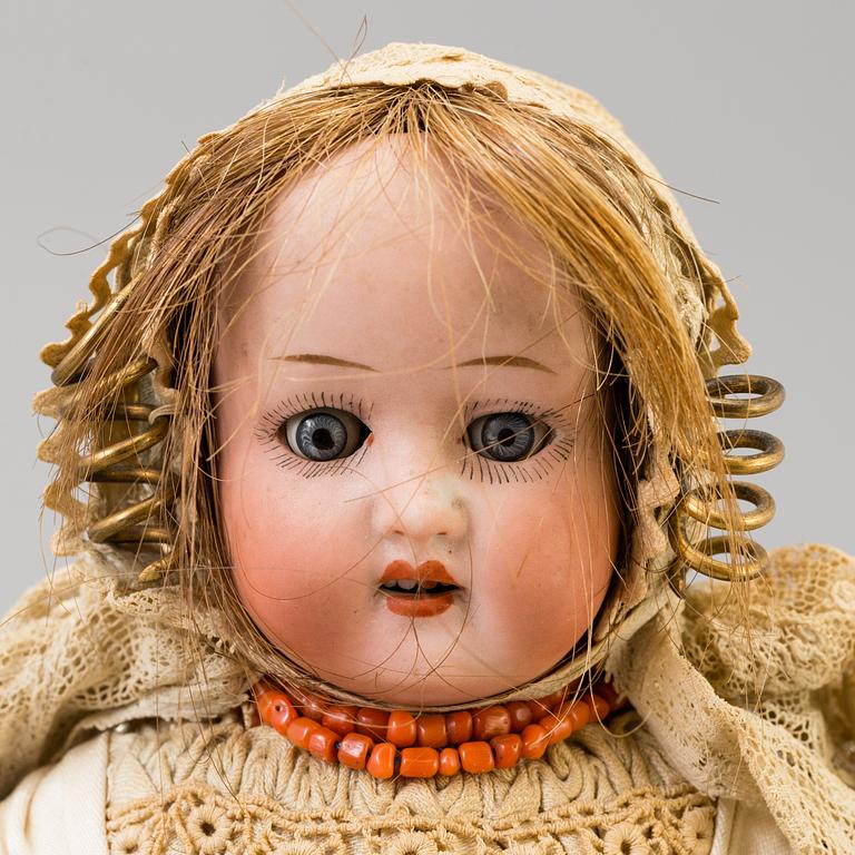 a HEUBACH KÖPPELSDORF porcelain doll, Germany in the first half of the 20th century.