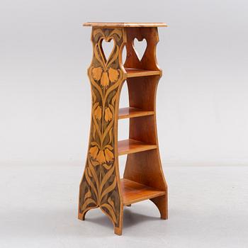 An early 20th century art nouveau shelf.