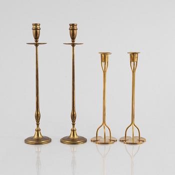 Two pairs of brass candlesticks, including 'Klöver' designed by Josef Frank for Firma Svenskt Tenn.
