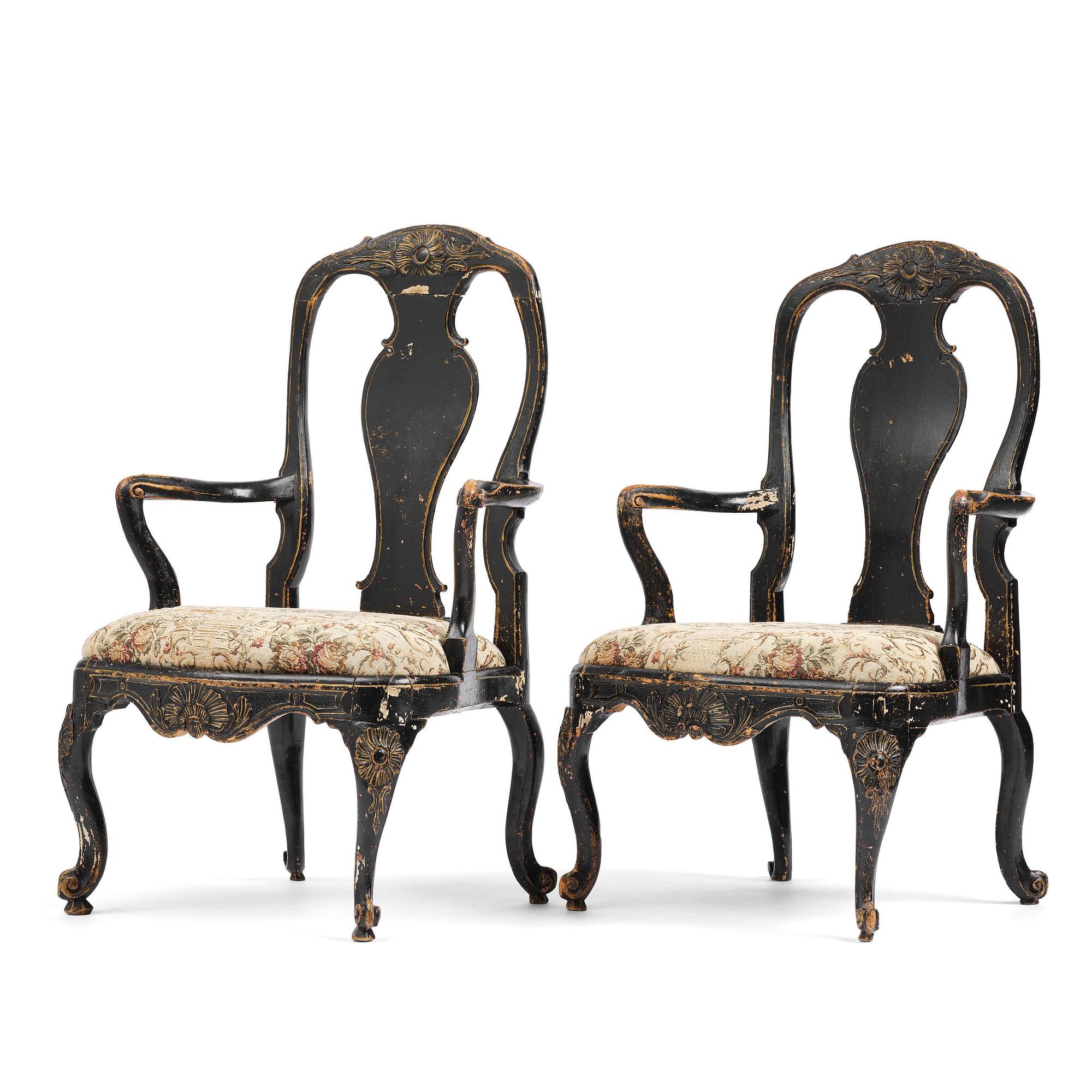 A pair of rococo armchairs in the manner of C. M. Sandberg, later part 18th century.