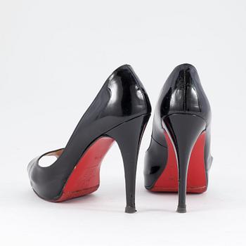 CHRISTIAN LOUBOUTIN, a pair of black leather peep-toe pumps. Size 37 1/2.