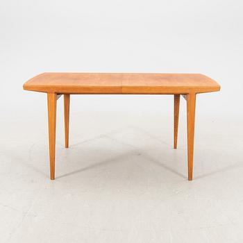 A 1950s teak dining table.