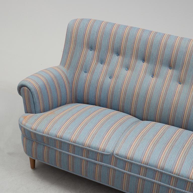 A Carl Malmsten"Hemmakväll" sofa from late 20th century.