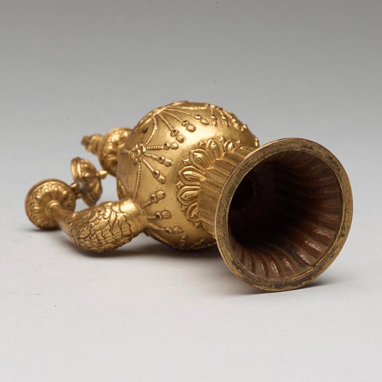 A Tibetan gilt copper bumpa, 19th Century.