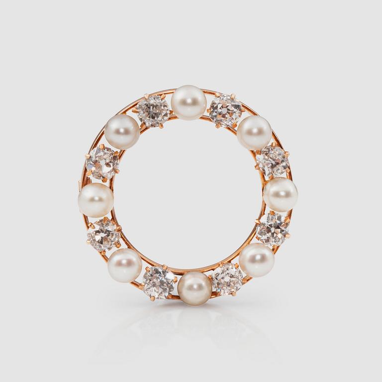 An old-cut diamond and cultured pearl brooch. Total carat weight of diamonds 1.60 ct.