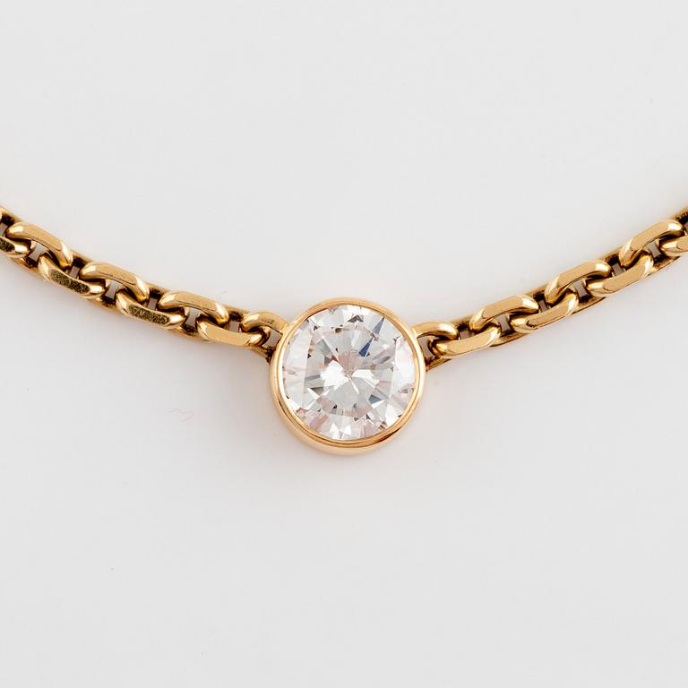 An 18K gold necklace set with an old-cut diamond.