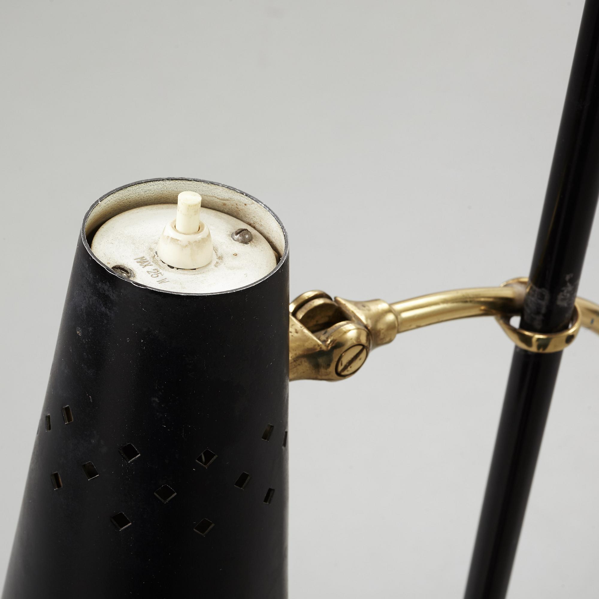 A Swedish Modern brass and black lacquered floor lamp, 1950's.