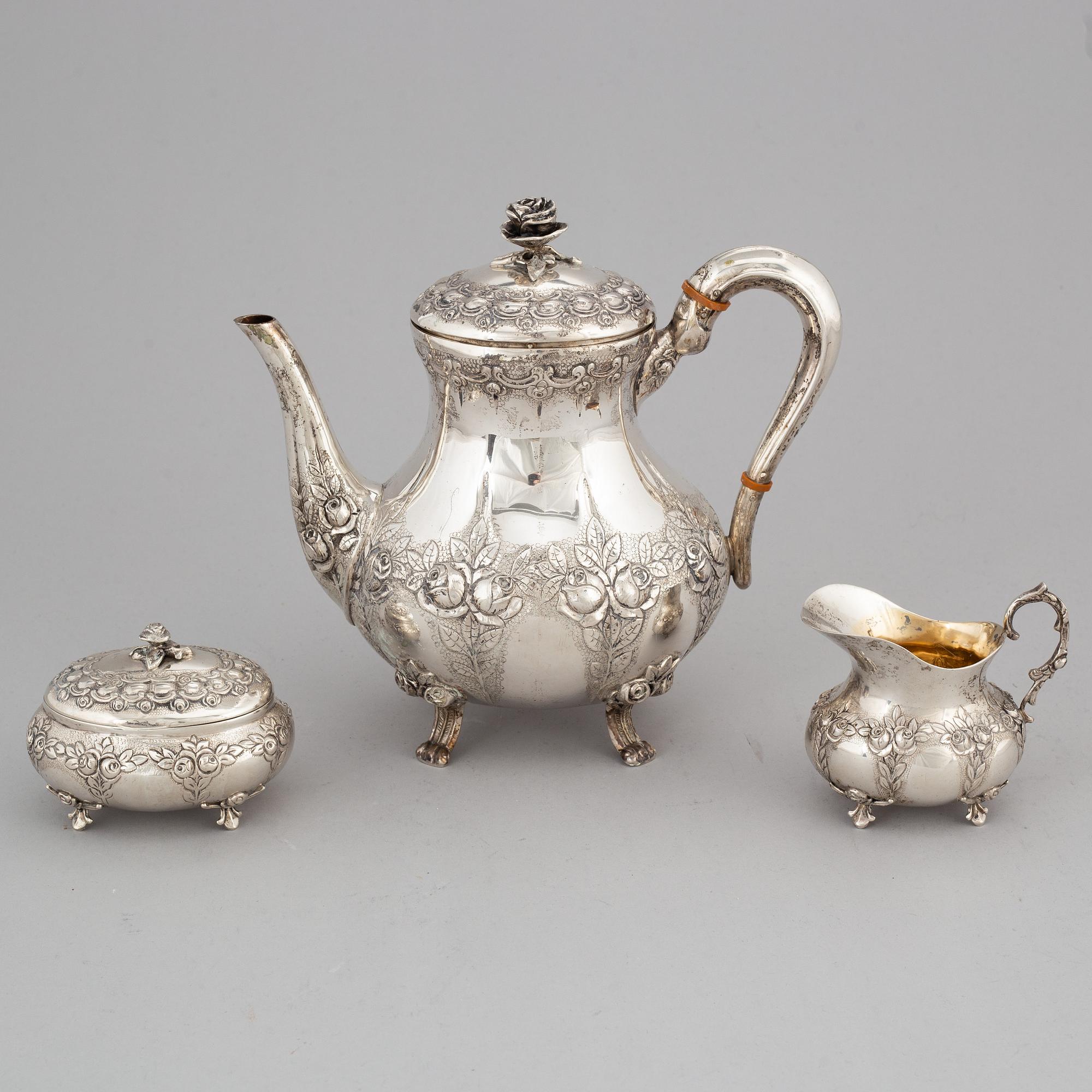 A silver coffee pot, creamer and sugar box. Swedish import mark.