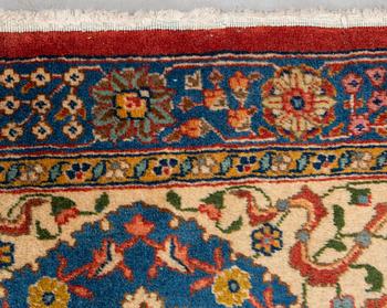 A carpet, a semi-antique Tabriz, ca 528-535 x 346,5-352,5 cm, signed Farhan.