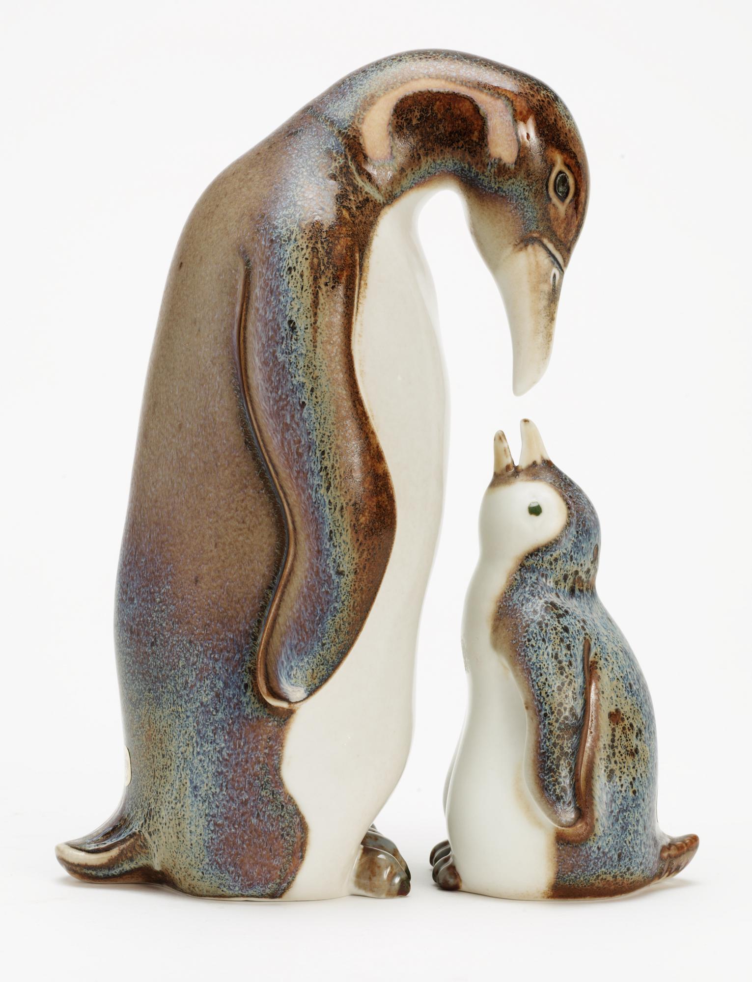 Two Gunnar Nylund stoneware figures depicting a penguin mother with child, Rörstrand.