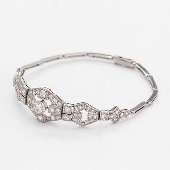 A platinum bracelet, set with brilliant- and single-cut diamonds.