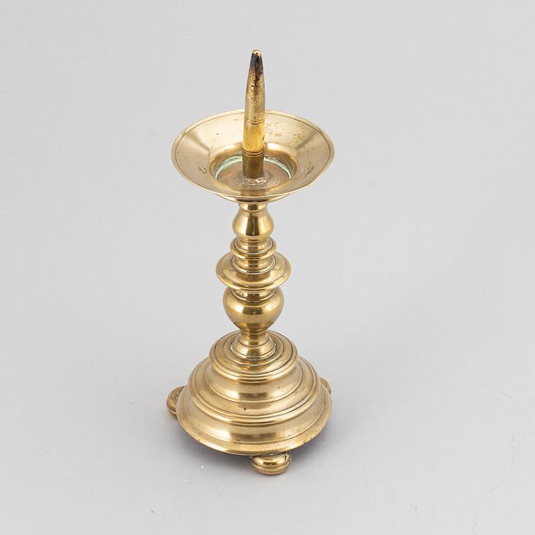 A 16th century bronze candlestick.