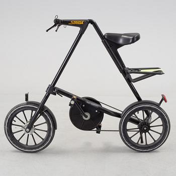 A foldable Strida bike.