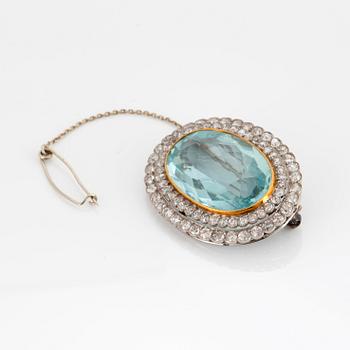 A BROOCH set with an aquamarine and old-cut diamonds.