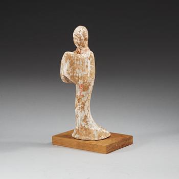 A potted figure of a court lady, Han dynasty (206 BC - 220 AD).