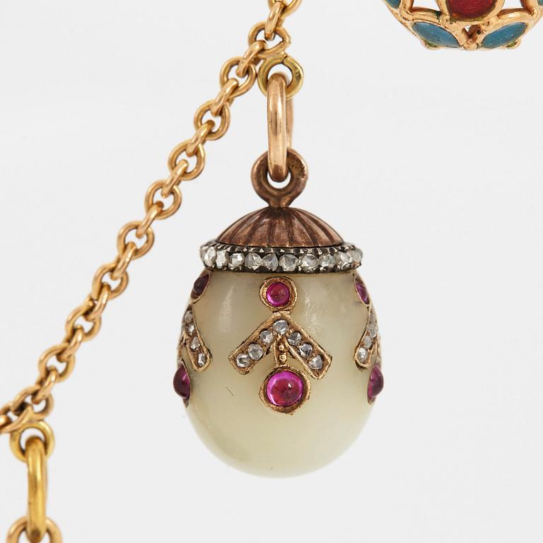 A FABERGÉ  GOLD Chain Necklace WITH 8 GOLD, ENAMEL ETC MINIATURE EASTER EGG PENDANTS, S.T PETERSBURG and 3 other.