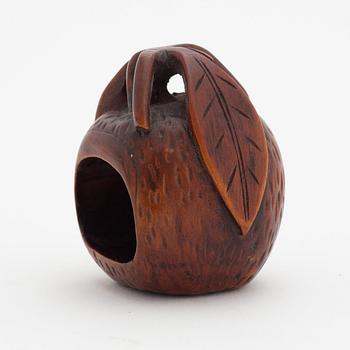 A Japanese carved corozo nut bird feeder, second half of the 19th Century.