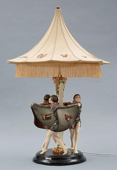 A Josef Lorenzl "The captured bird" triple figural lamp, Goldscheider, Wien circa 1925.