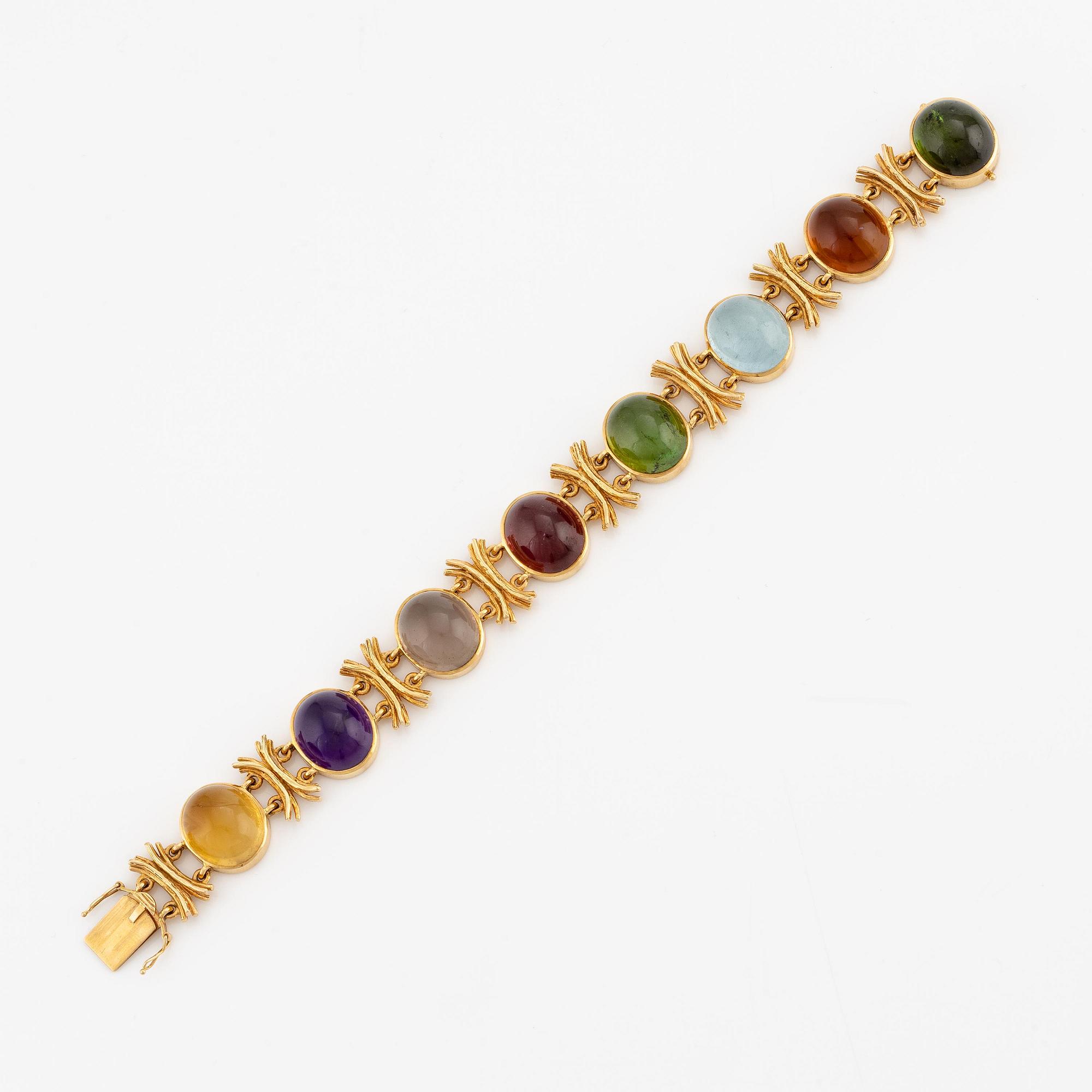 W.A. Bolin, design Barbro Littmarck, armband, 18K guld med cabochonslipade färgstenar, Stockholm 1970.