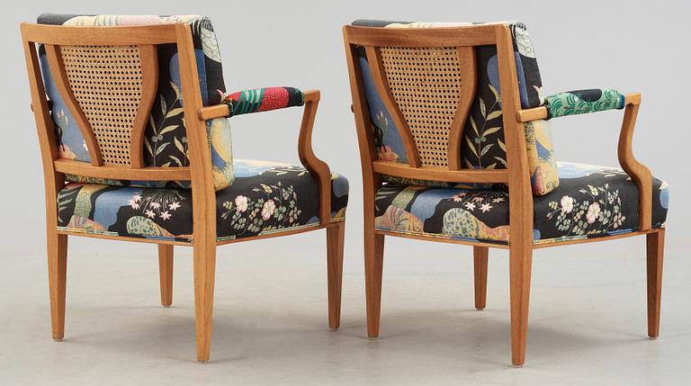 A pair of Josef Frank mahogany and ratten armchairs, Svenskt Tenn, model 969.