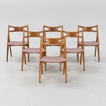 A set of six model CH 29 'Savbukstolen' by Hans J Wegner, designed 1952.