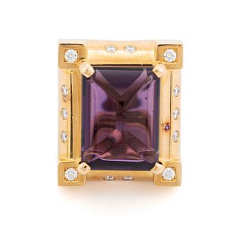 394. An 18K gold Acchinelli ring set with a faceted amethyst and round brilliant-cut diamonds.