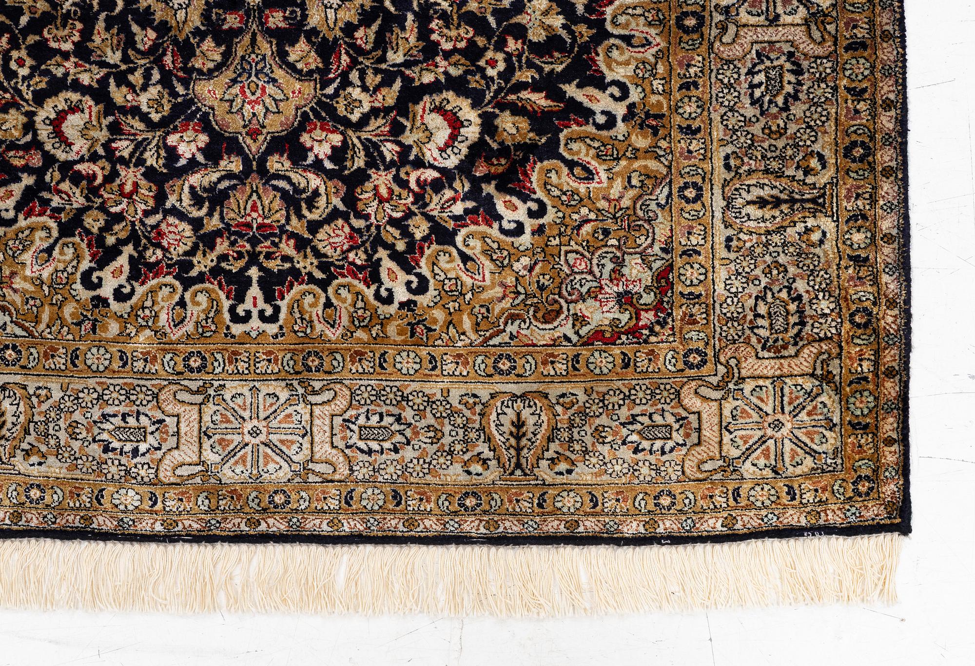 A Ghom, silk rug, c. 162 x 102 cm.