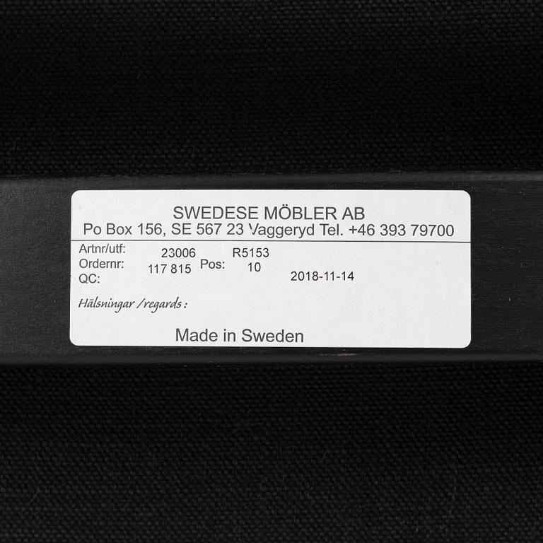 Yngve Ekström, a  'Lamino' easy chair with foot stool, Swedese, 2018.