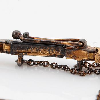An 18K gold and platinum bracelet set with old-cut diamonds.