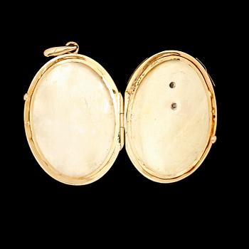 MEDALJONG, 18 k guld, omkring år 1900. Total vikt ca 12 g.