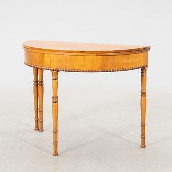 A kid 1800s late Empire birch game table.