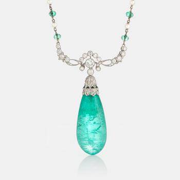 951. An emerald and diamond pendant with the emerald measuring ca 14.8 X 13.7 X 33.0 mm.