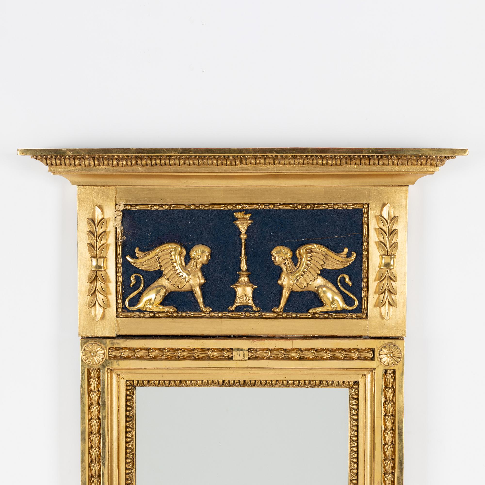 An Empire mirror, first half of the 19th Century.