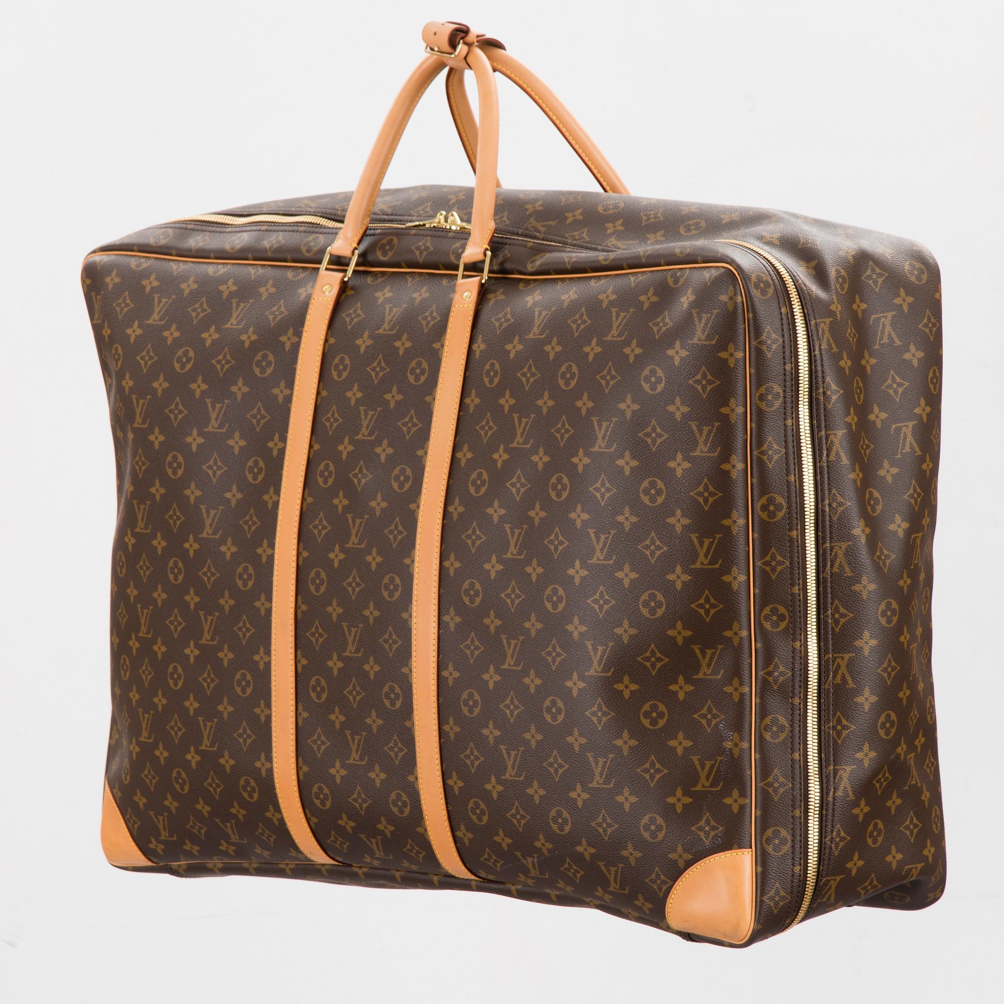 A Monogram Canvas Sirius 70 Suitcase. - Bukowskis