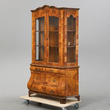 A 20th Century rococo style vitrine cabinet.