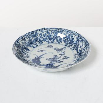 Two Chinese blue and white porcelain dishes and a small dish, Qing dynasty, 18th century.