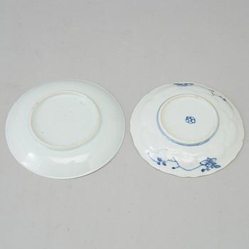 Two blue and white dishes and two cups with dishes, Qing dynasty, Qianlong (1736-95) and Kangxi (1662-1722).