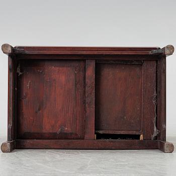 A small Chinese wooden cabinet, 1900s.