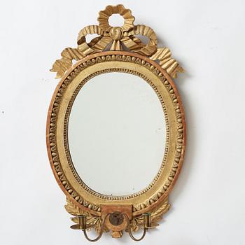 A late gustavian girandole mirror signed by Claes Eric Reding, Karlskrona, (master 1808-1815).