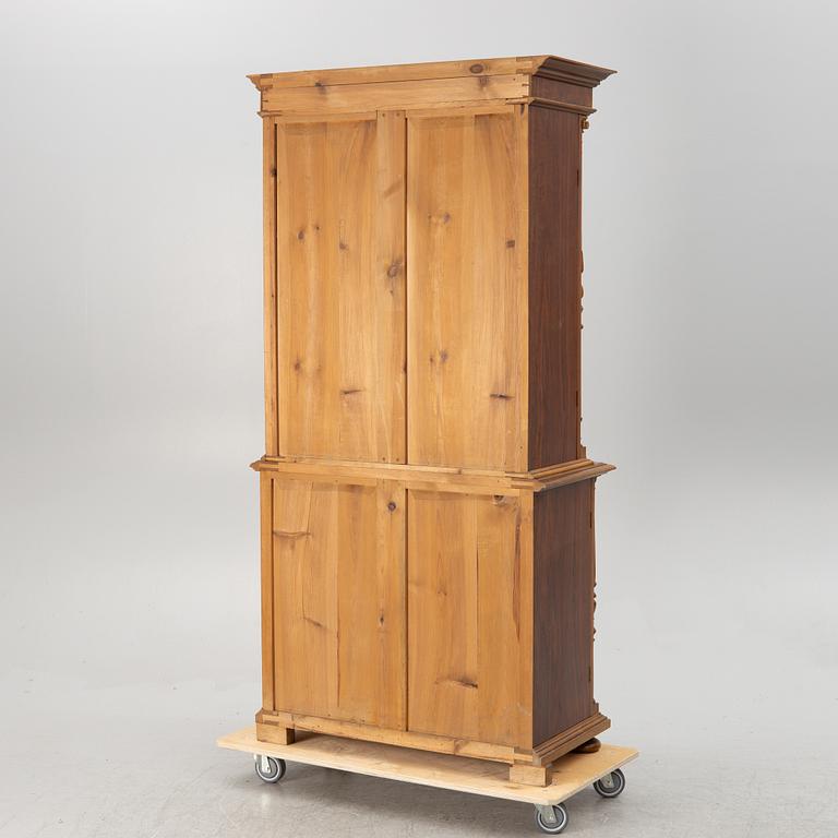 A book cabinet, around the year 1900.