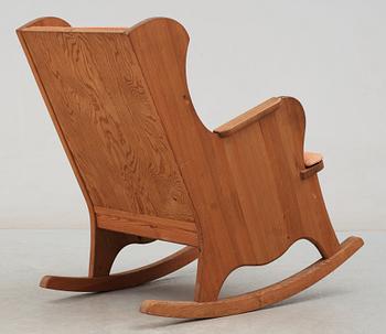 An Axel Einar Hjorth 'Lovö' stained pine rocking chair Nordiska Kompaniet, 1930's.