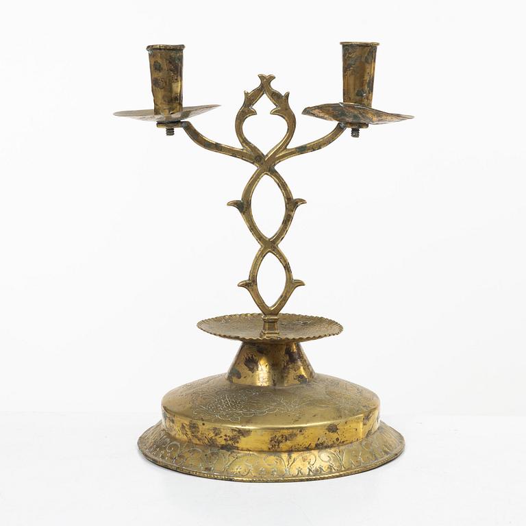 A Swedish brass two-branch candlestick, 18th/first part 19th century.